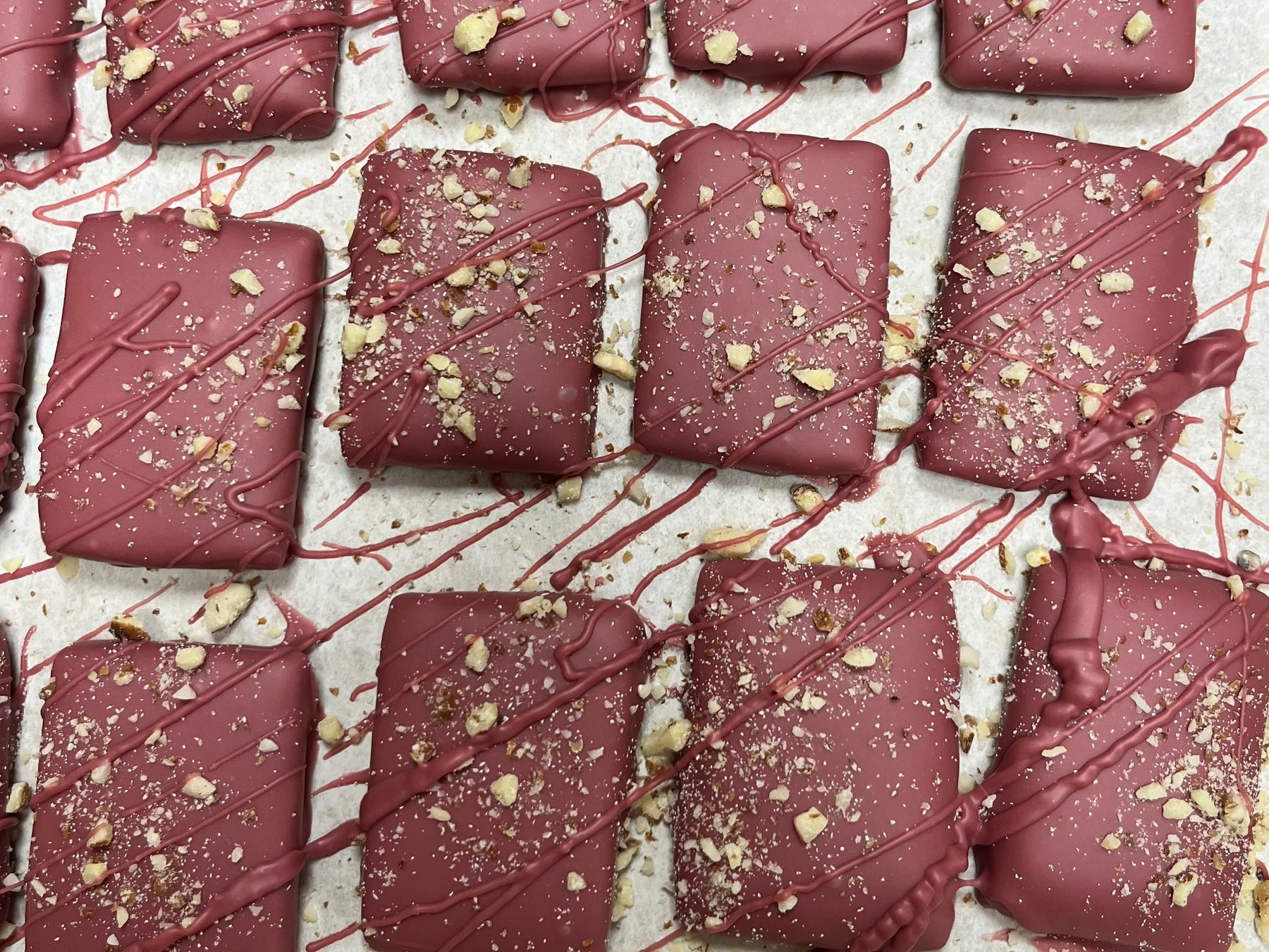 Toffee made with Door County Cherries, Roasted Almonds and covered in Ruby Chocolate