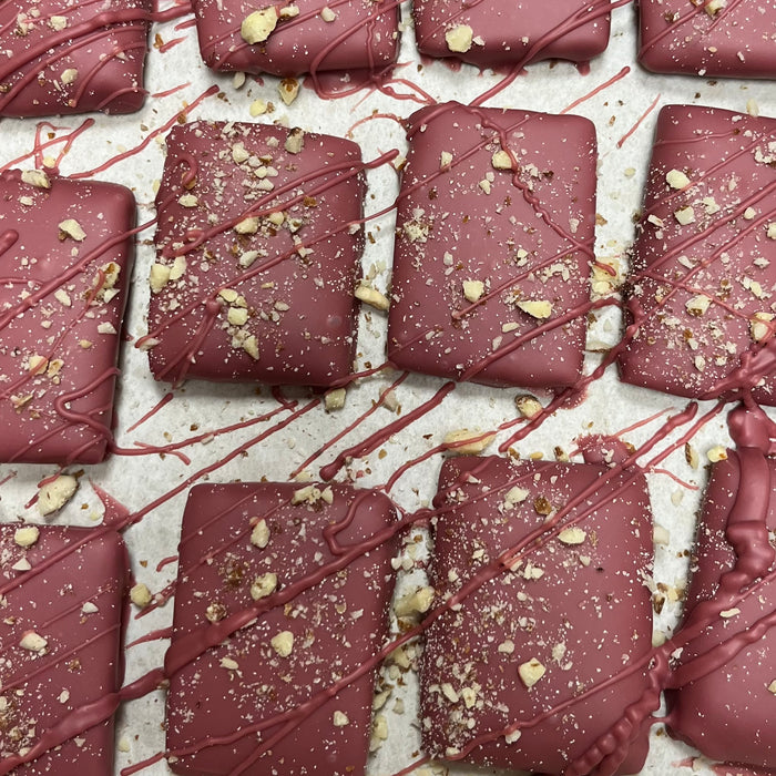 Toffee made with Door County Cherries, Roasted Almonds and covered in Ruby Chocolate