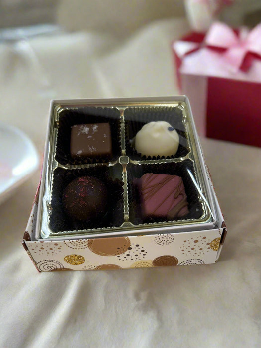 Gift box that includes Sea Salt Caramel, Ruby French Silk, Dark Raspberry and White Violet. 