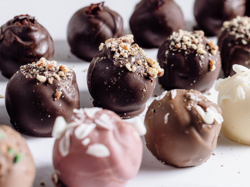 An assortment of chocolate cremes including Pink Squirrel, Brandy Alexander and Brandy Old Fashion