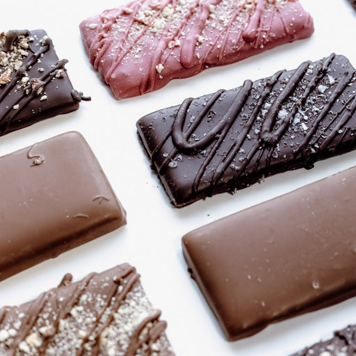 Assorted chocolate bars on a white background