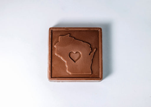 Milk chocolate bar with a cutout of Wisconsin featuring a heart in the center.