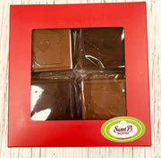 A photo of a chocolate bar gift box with the shape of Wisconsin state and a heart cut-out in the center, indicating a tribute to the state.